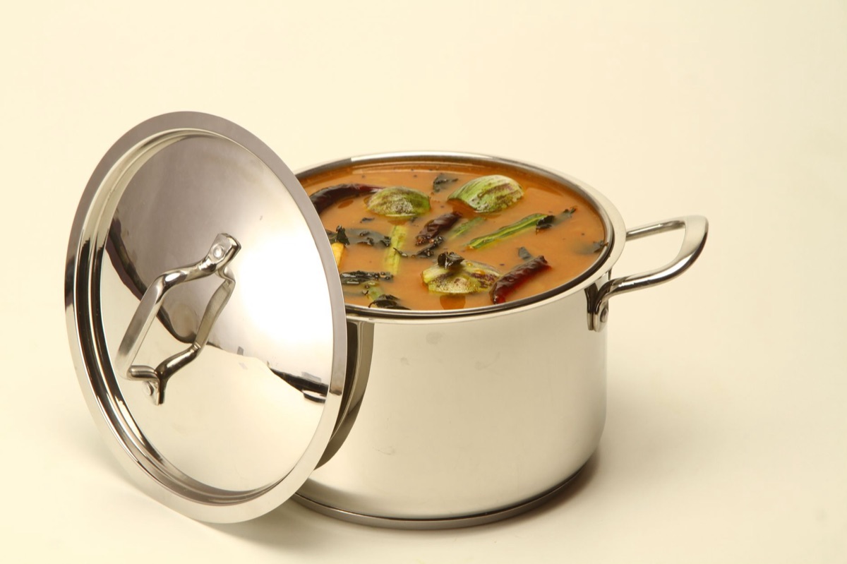 Lentil soup with vegetables in white bowl