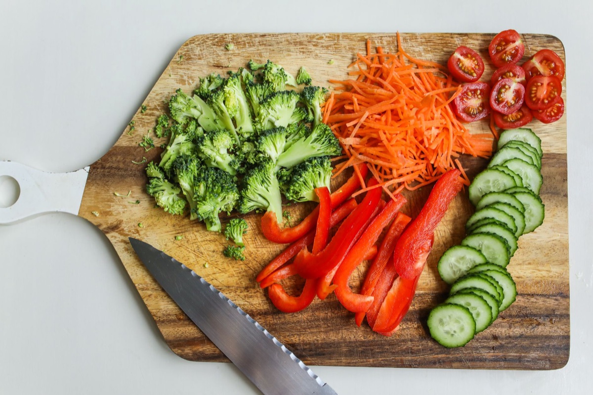 broccoli in kitchen with knife