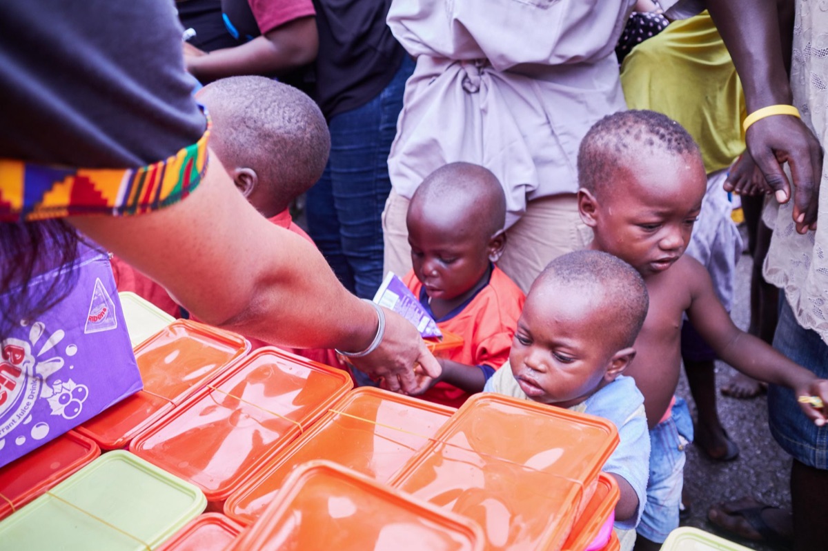 Children in a community center receiving a nutritious meal program
